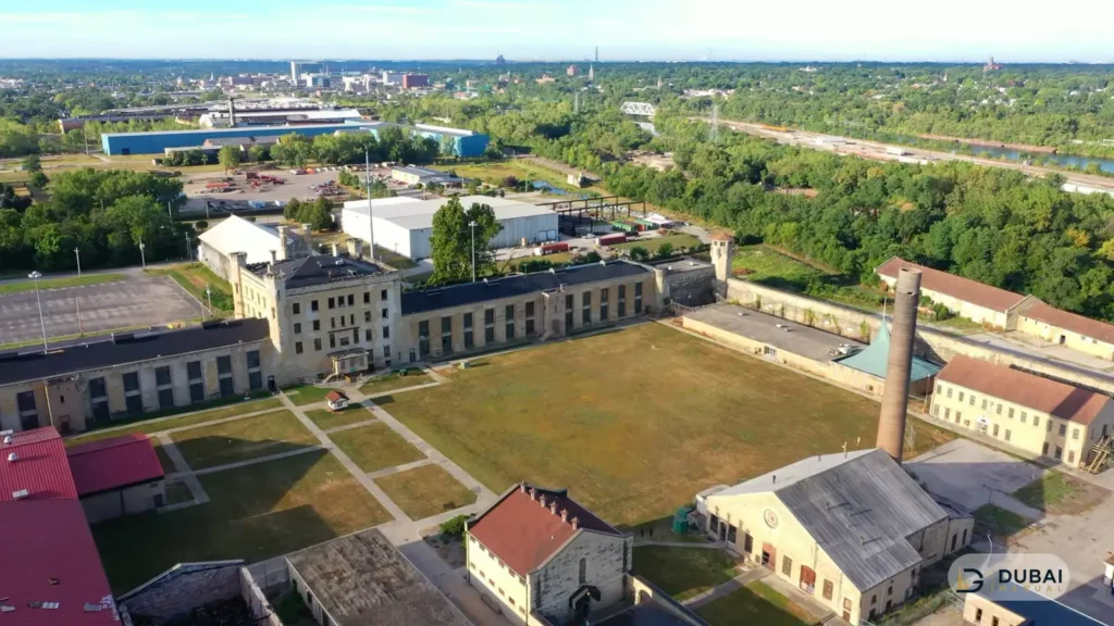 Aerial view of a detention facility with cell blocks and central yard