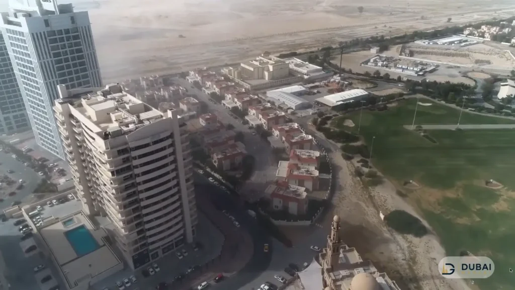 Aerial view of Dubai Sports City villas and golf course near Frankfurt Sports Tower