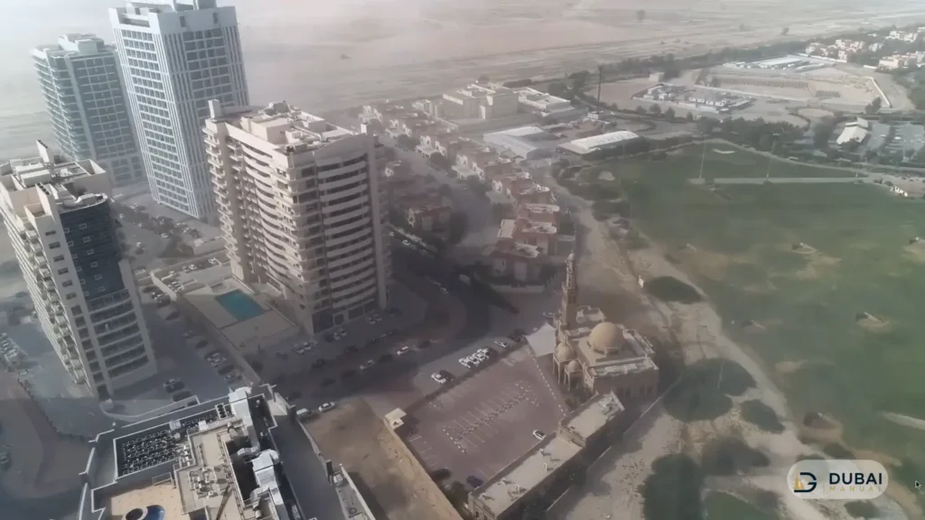 Aerial view of Frankfurt Sports Tower area in Dubai Sports City with villas and mosque