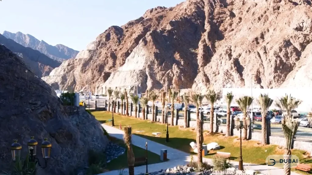 Aerial view of Shees Park beneath the Hajar Mountains