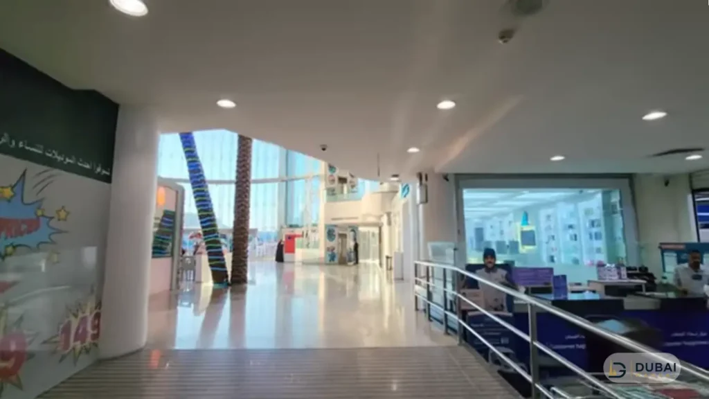 Al Shatea Mall entrance with palm trees and customer service desk