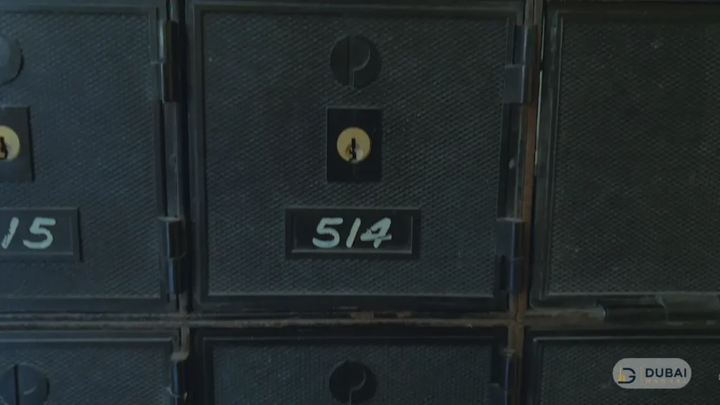 Close-up of numbered P.O. box doors with keyholes