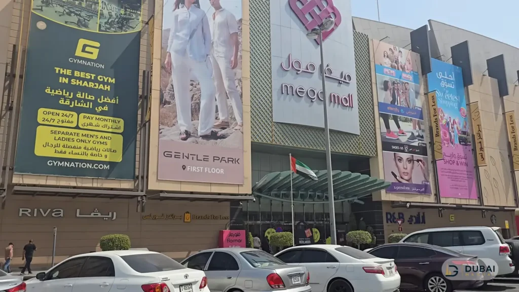 Daytime exterior of Mega Mall Sharjah with mall signage