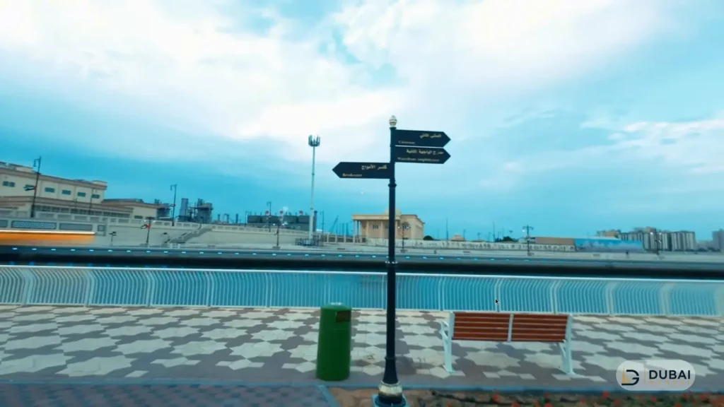 Directional signpost on the Al Layyah Canal promenade