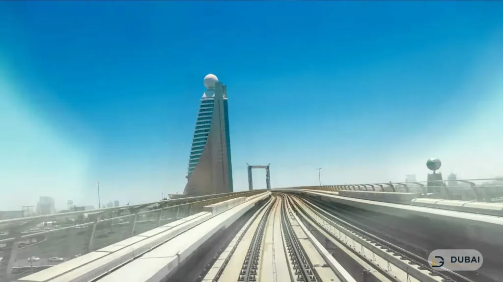 Dubai Metro elevated track curving past the Rose Rayhaan tower
