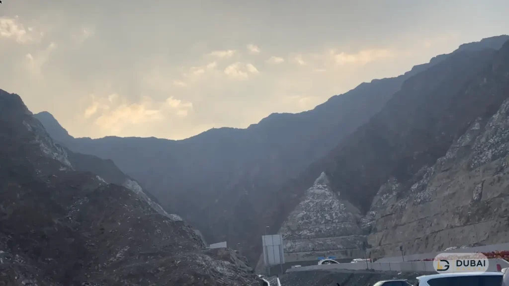 Hajar mountain valley with road and tunnel near Shees