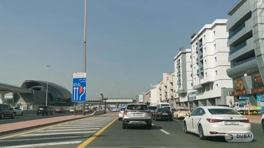 Ittihad Road with Dubai Metro station near Al Mulla Plaza