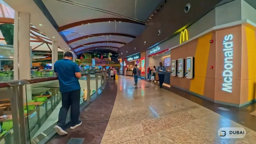 Mall walkway with McDonald's and food court seating at Sahara Centre