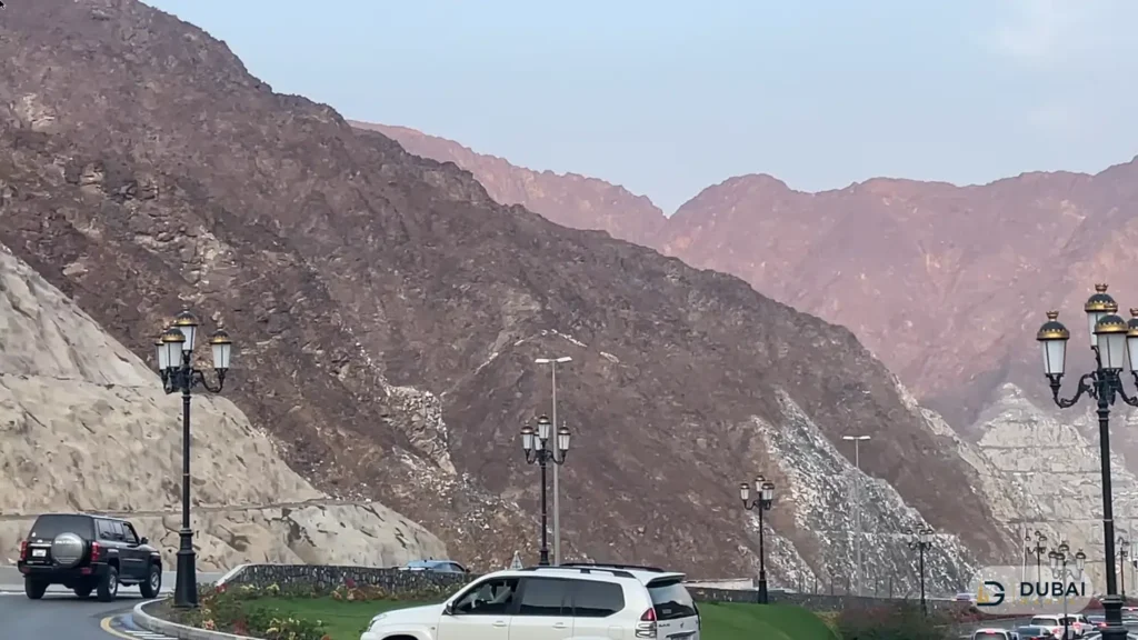 Mountain road with street lamps through the Hajar mountains