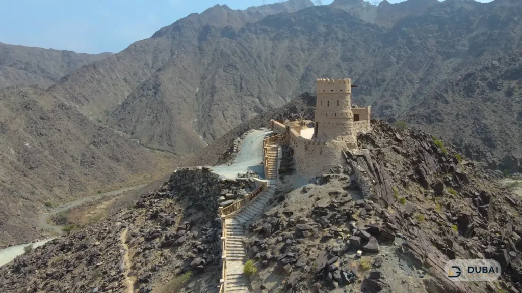 Najd Al Maqsar fortress on the mountain summit with stepped trail