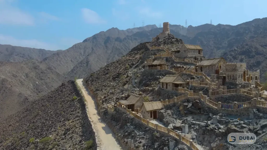 Najd Al Maqsar heritage stone houses with palm-thatch roofs