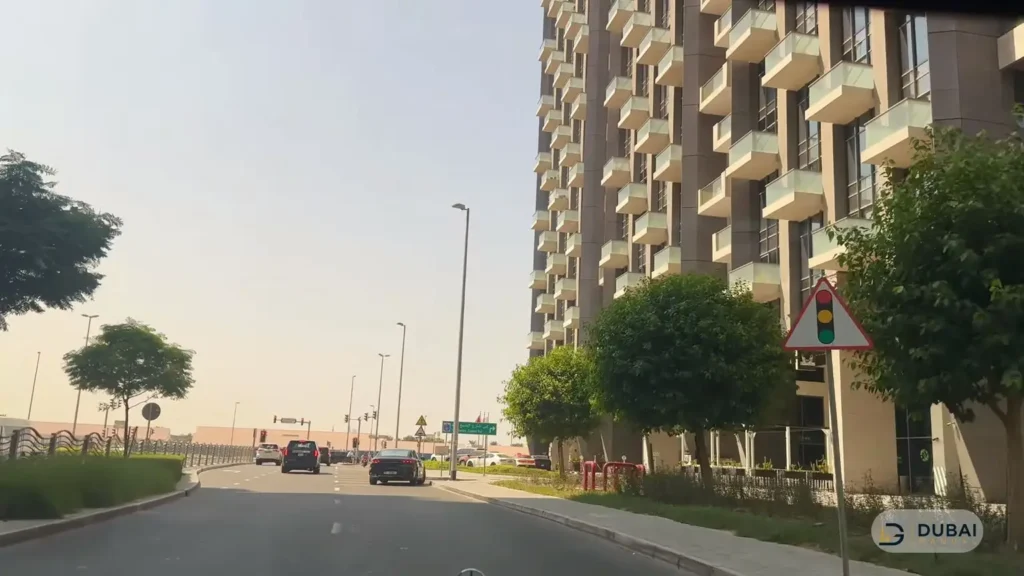 Residential tower with balconies on a Business Bay street near DAMAC Zada Tower