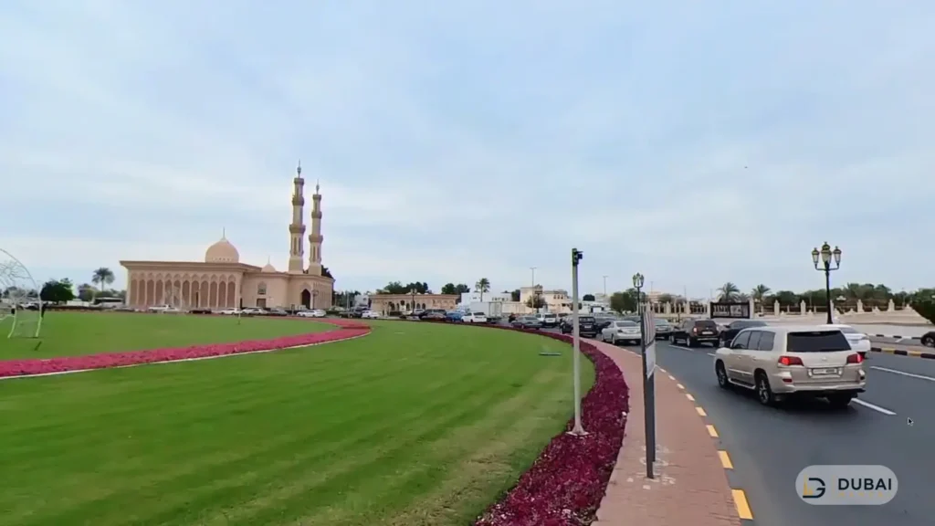 Road and parking area near Cultural Square Sharjah with a mosque