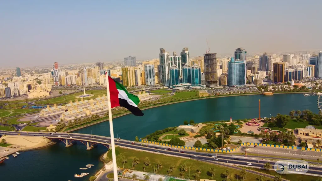 UAE flag flying from the 123-metre pole over Khalid Lagoon
