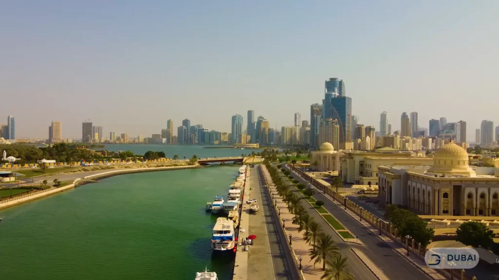 Waterfront promenade and marina beside Flag Island in daylight